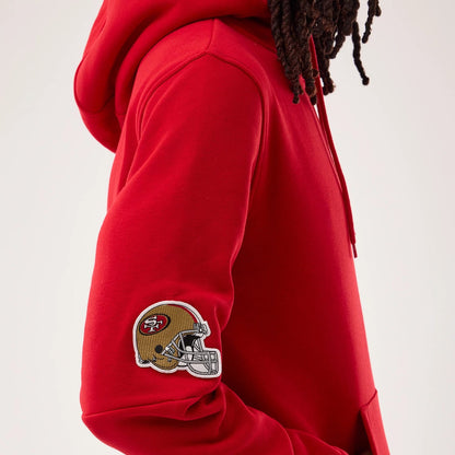 The model is wearing this NFL Sideline 2026 San Francisco 49ers Pullover Hoodie in red. 5