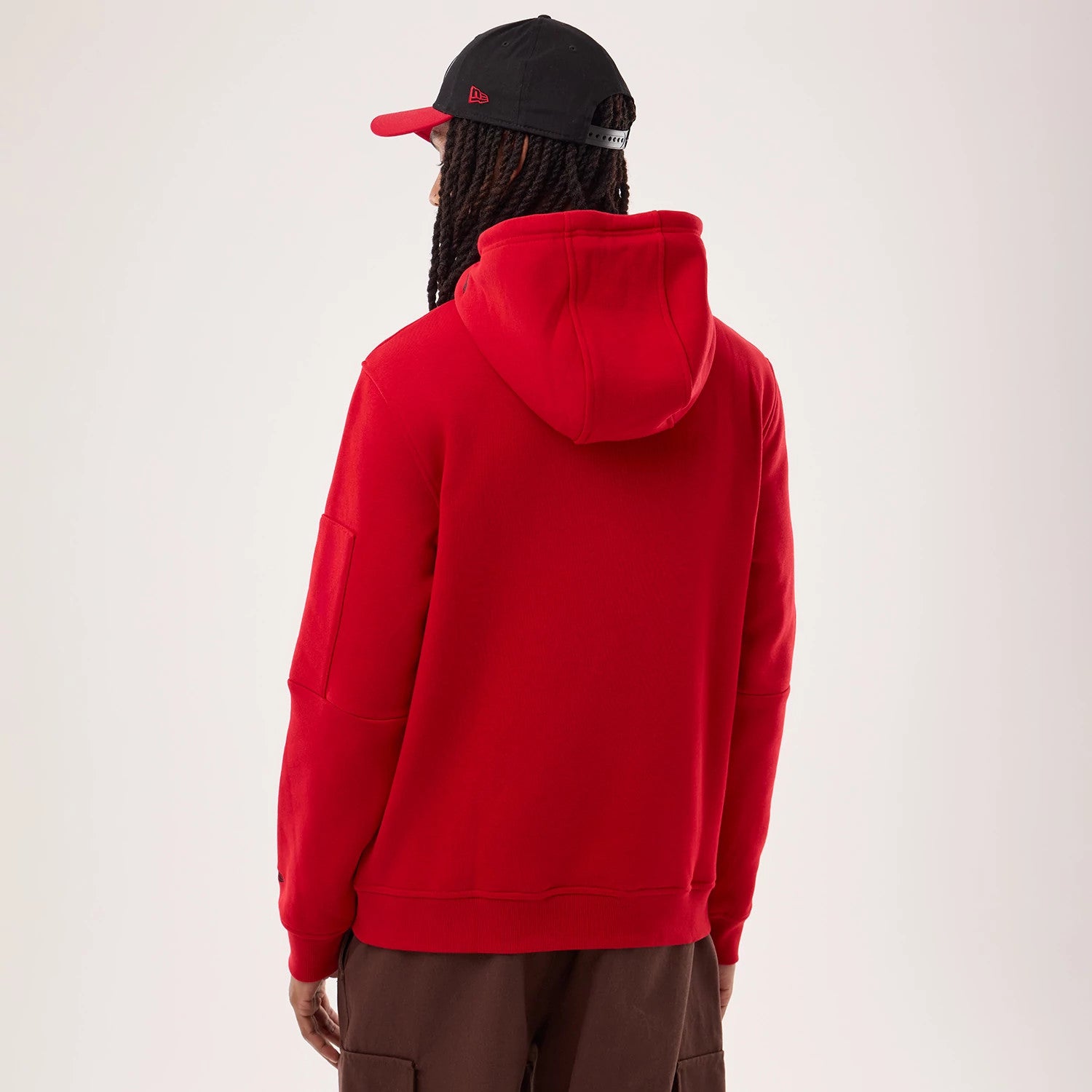 The model is wearing this NFL Sideline 2026 San Francisco 49ers Pullover Hoodie in red. 2