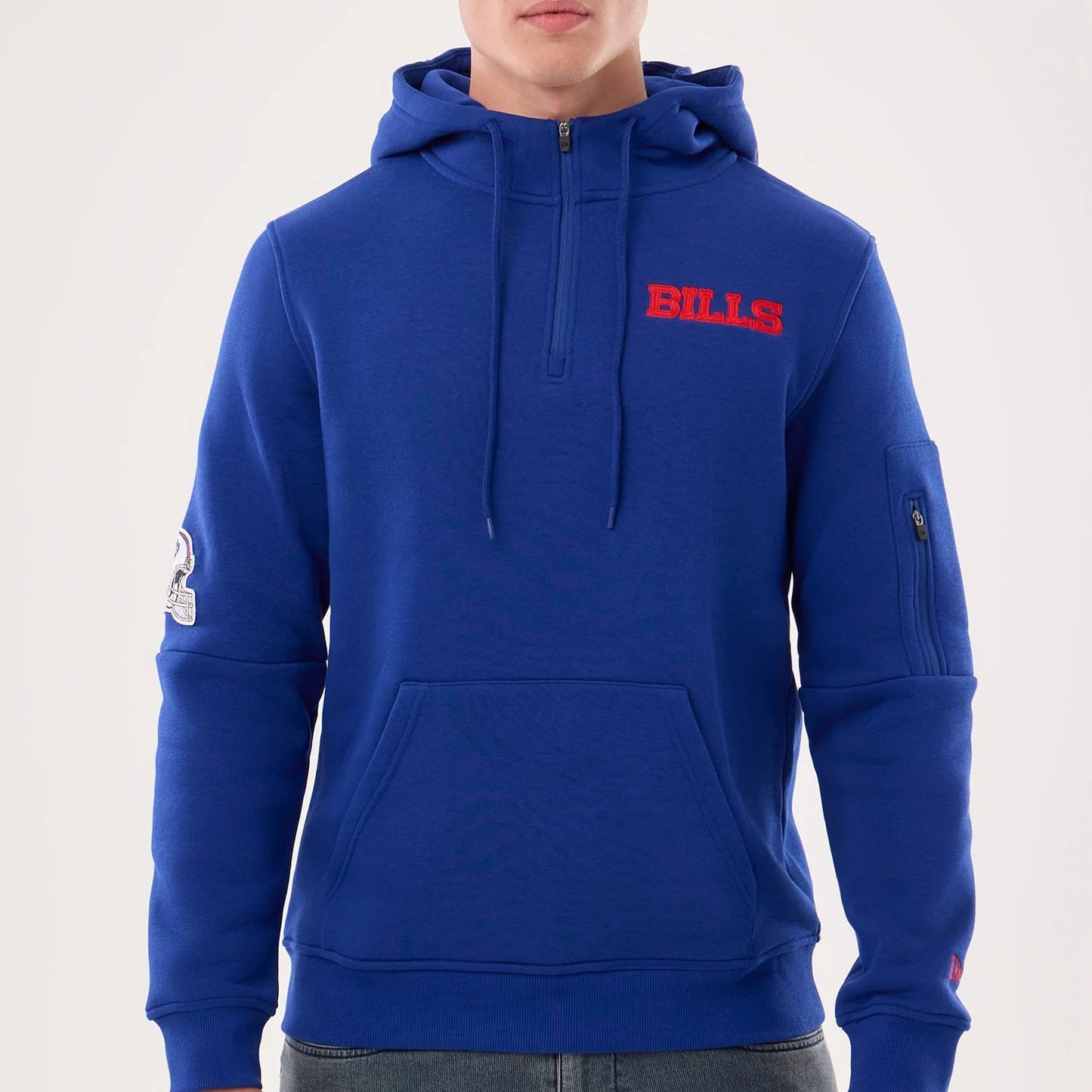 The model is wearing this NFL Sideline 2026 Buffalo Bills Pullover Hoodie in blue. 3