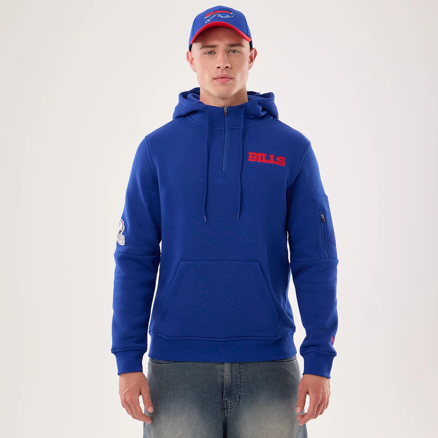 The model is wearing this NFL Sideline 2026 Buffalo Bills Pullover Hoodie in blue. 1