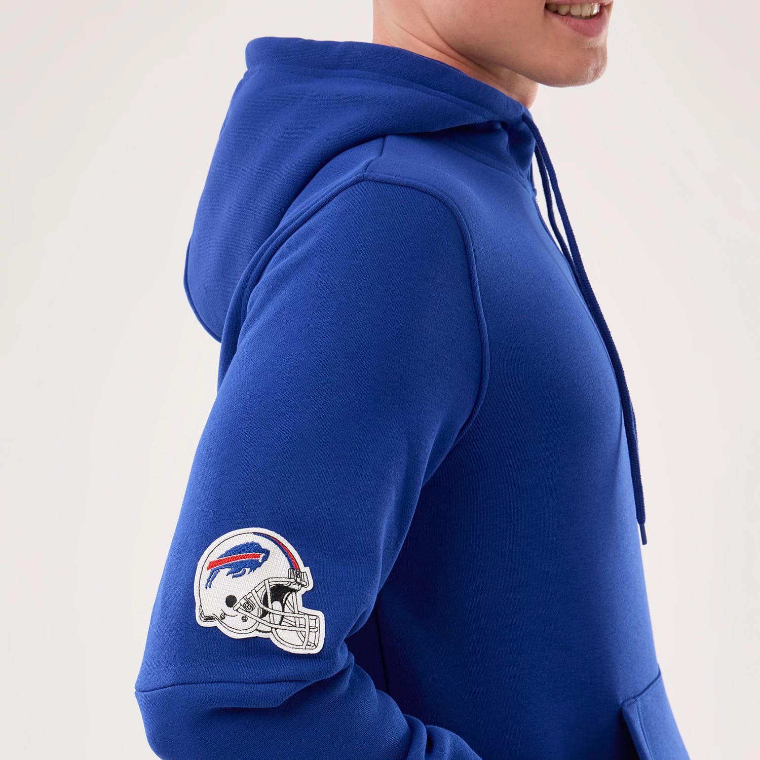 The model is wearing this NFL Sideline 2026 Buffalo Bills Pullover Hoodie in blue. 6
