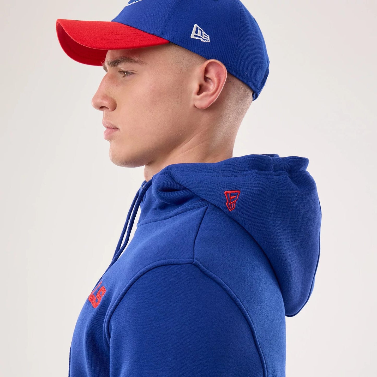 The model is wearing this NFL Sideline 2026 Buffalo Bills Pullover Hoodie in blue. 7