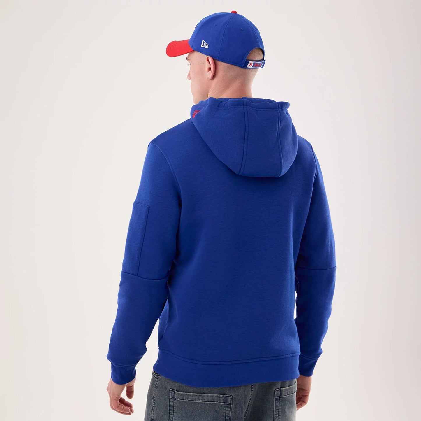 The model is wearing this NFL Sideline 2026 Buffalo Bills Pullover Hoodie in blue. 2