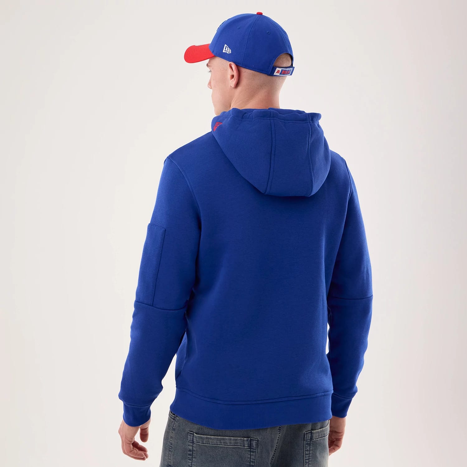 The model is wearing this NFL Sideline 2026 Buffalo Bills Pullover Hoodie in blue. 2