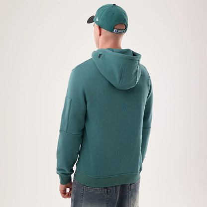 The model is wearing this NFL Sideline 2026 Philadelphia Eagles Pullover Hoodie in dark green. 2