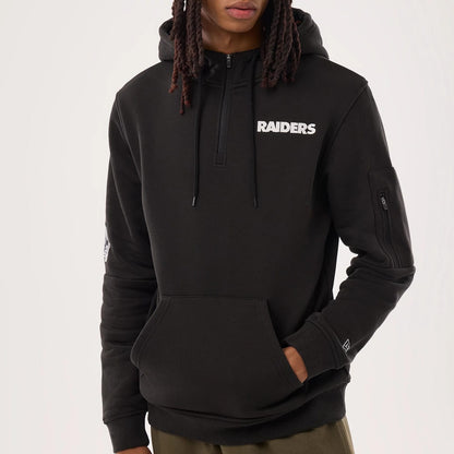 The model is wearing this NFL Sideline 2026 Las Vegas Raiders Pullover Hoodie in black. 3