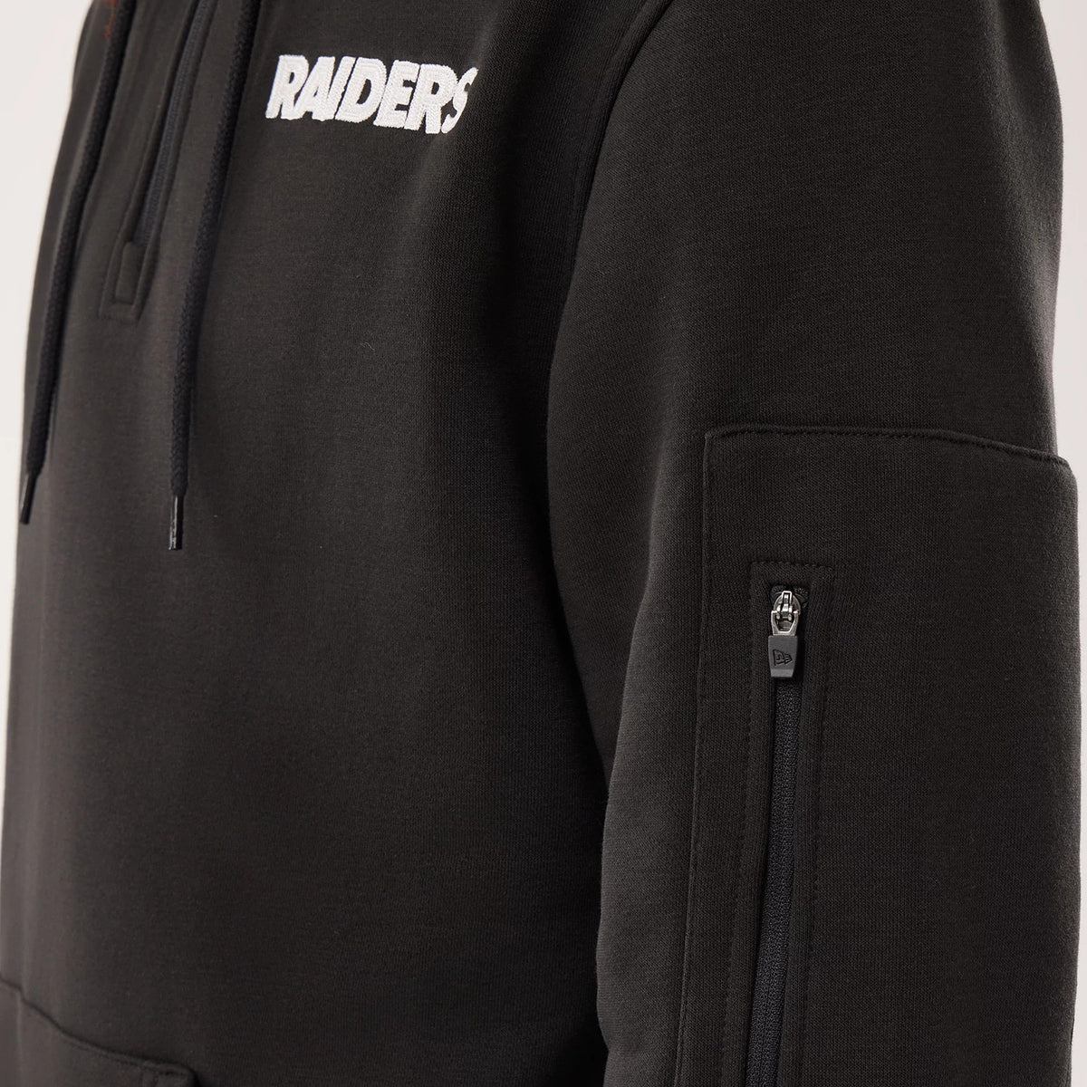 The model is wearing this NFL Sideline 2026 Las Vegas Raiders Pullover Hoodie in black. 4