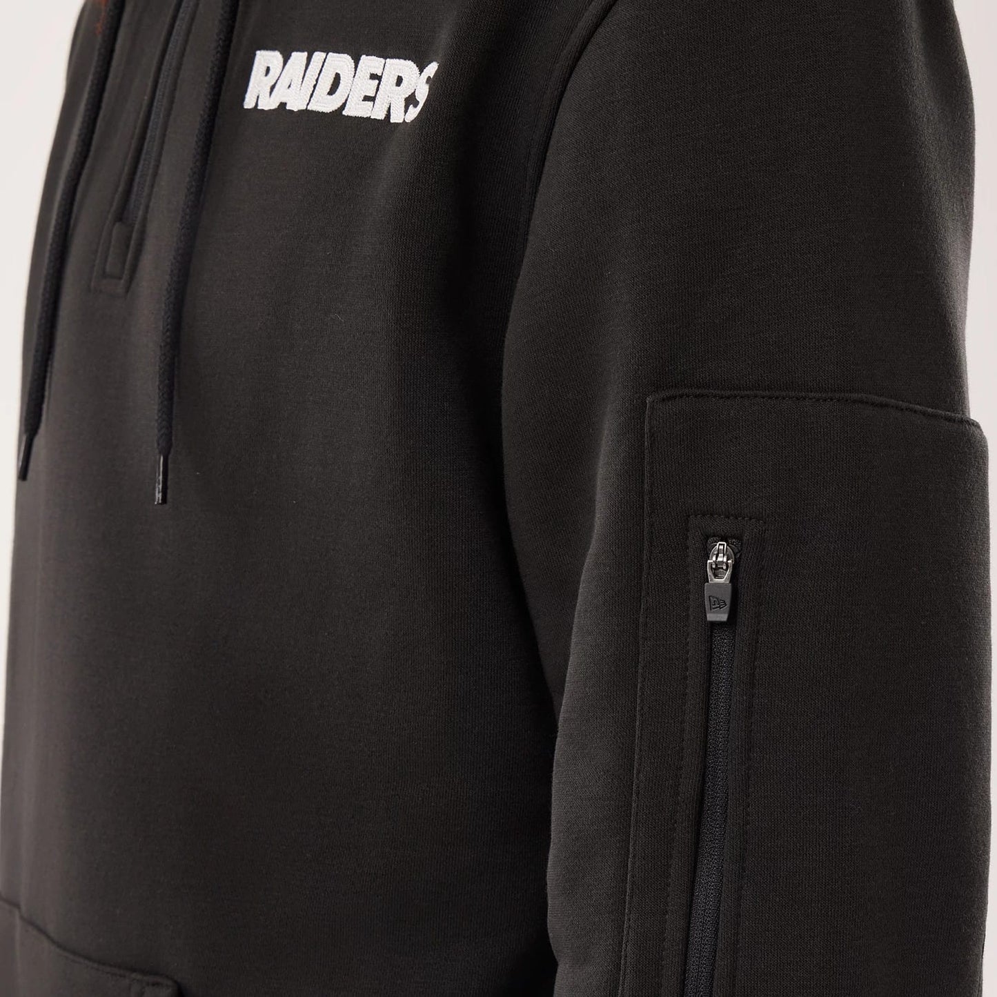The model is wearing this NFL Sideline 2026 Las Vegas Raiders Pullover Hoodie in black. 4