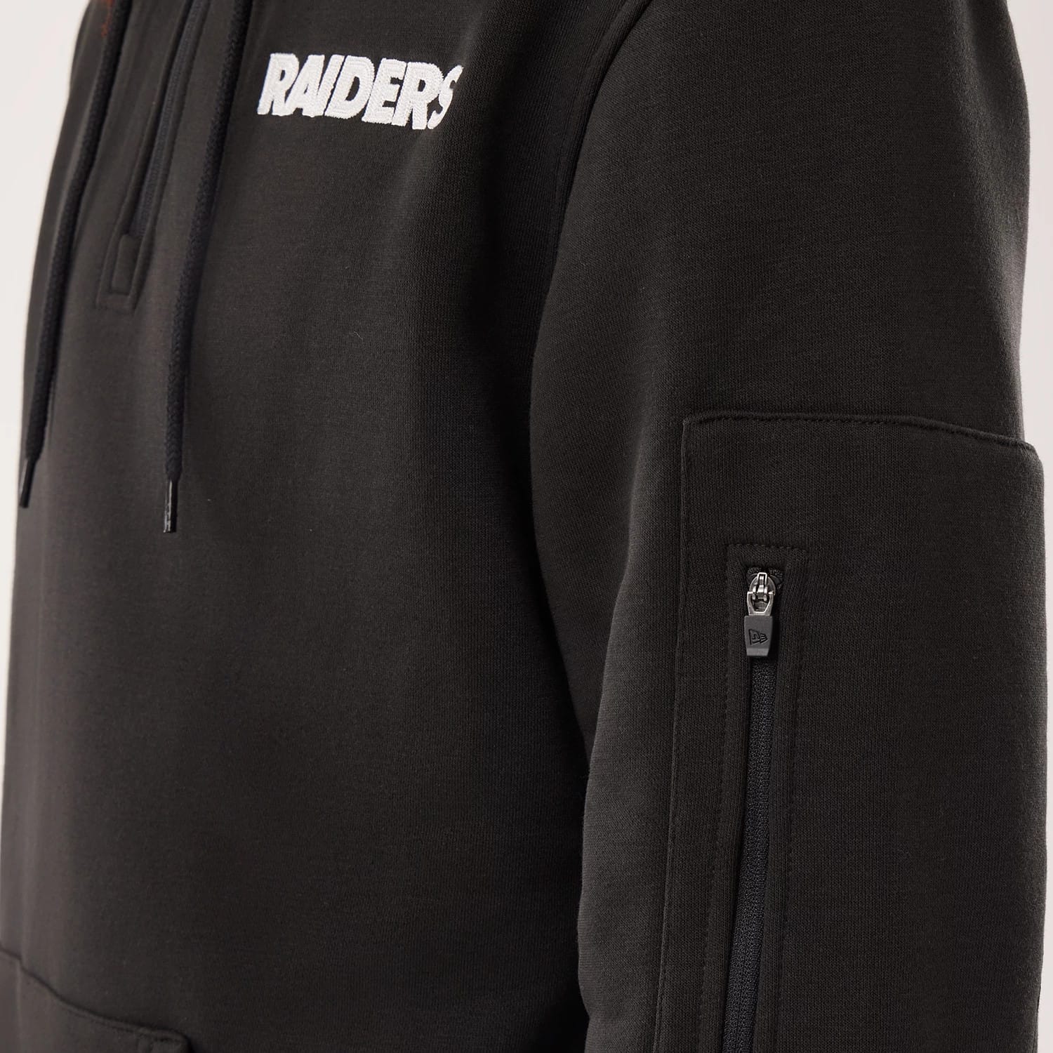 The model is wearing this NFL Sideline 2026 Las Vegas Raiders Pullover Hoodie in black. 4