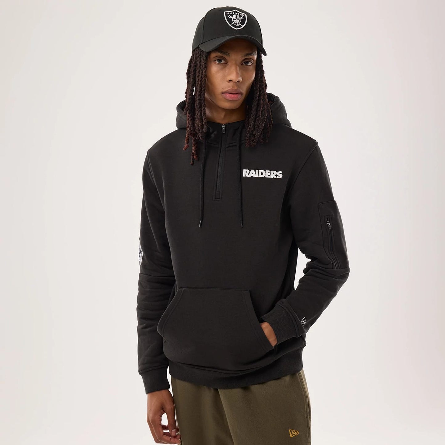 The model is wearing this NFL Sideline 2026 Las Vegas Raiders Pullover Hoodie in black. 1