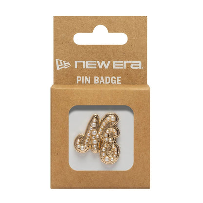 Pictured is this New Era Faux Pearl Pin Badge in gold. 3