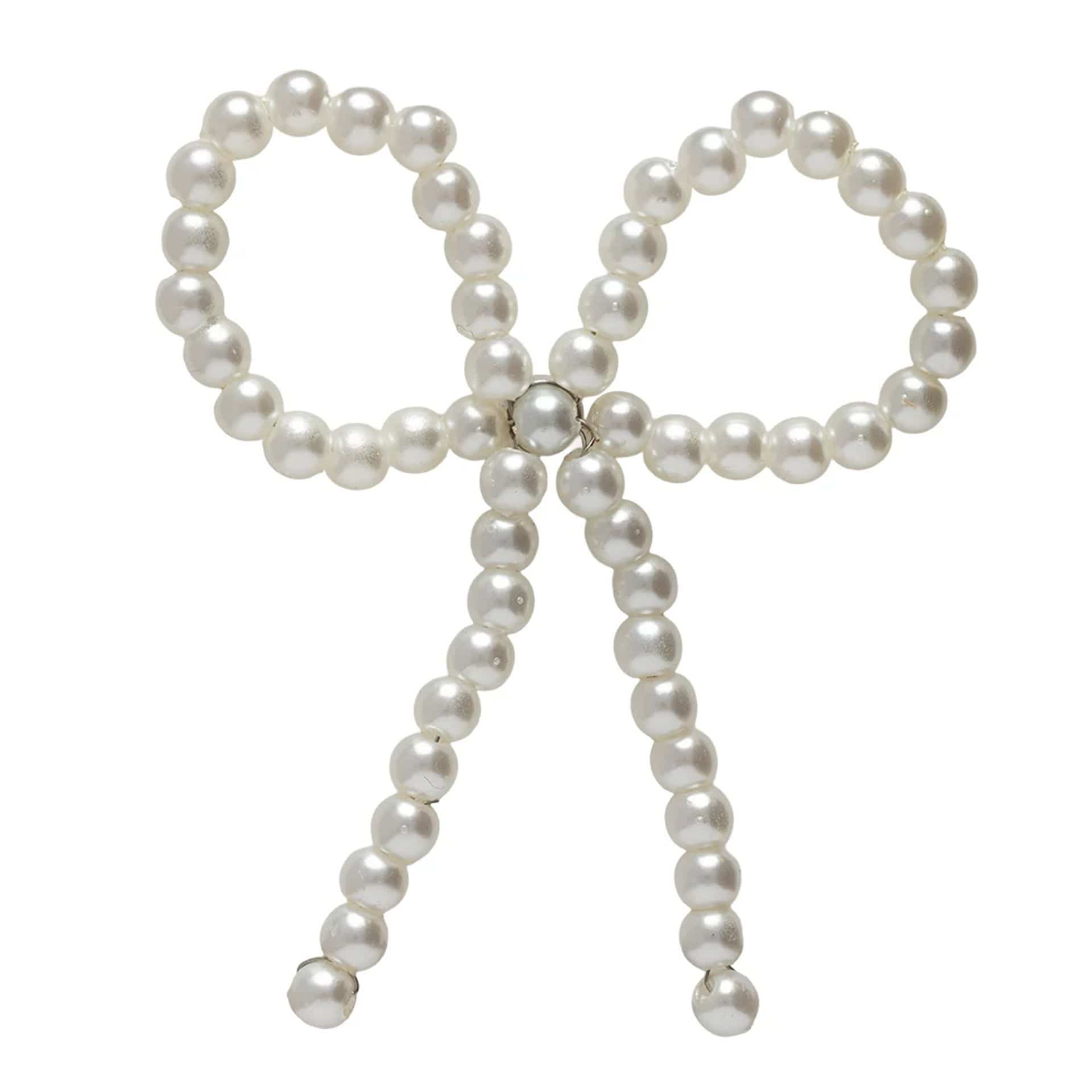 Pictured is this New Era Faux Pearl Bow Pin Badge in White. 1