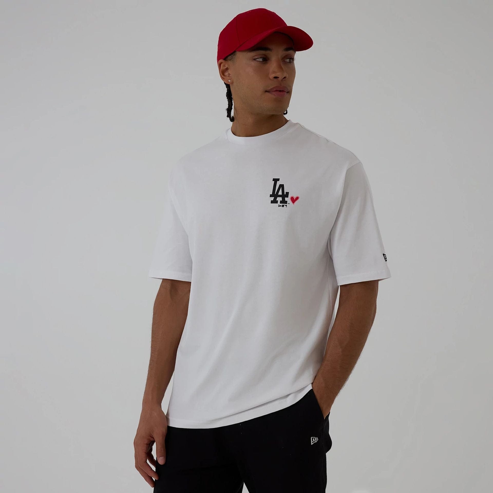 The model is wearing this MLB Heart Graphic LA Dodgers T-Shirt in white. 1