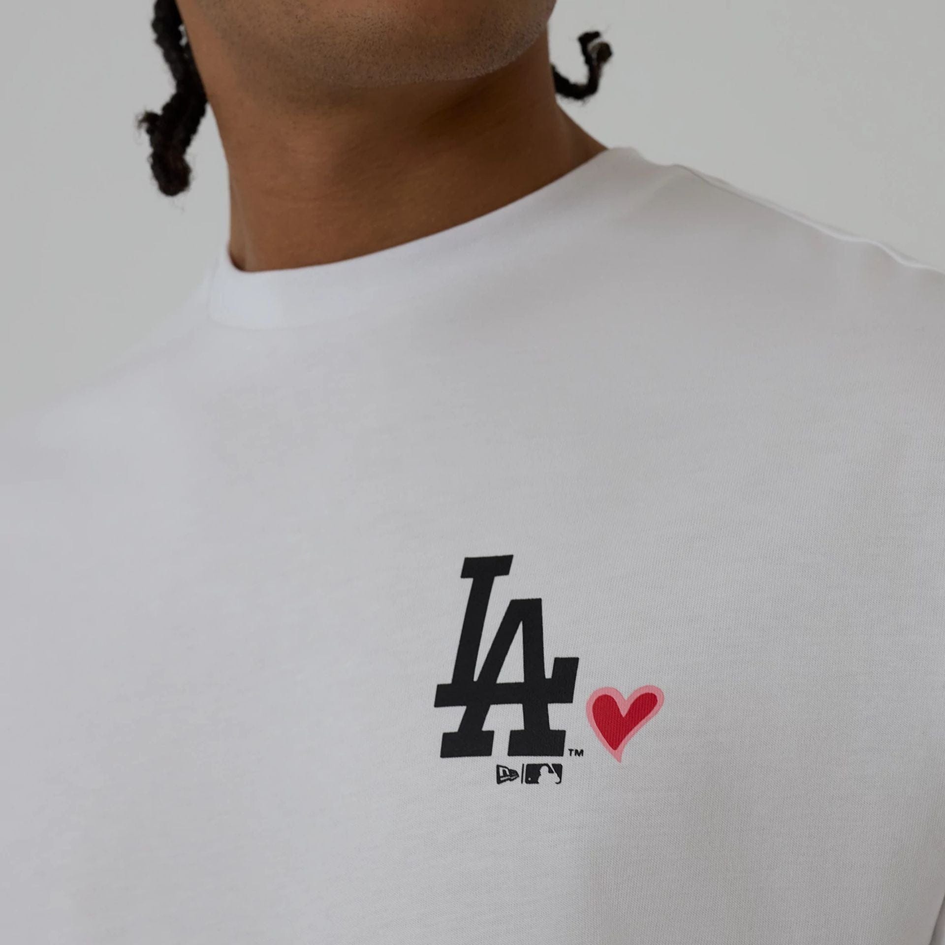 The model is wearing this MLB Heart Graphic LA Dodgers T-Shirt in white. 4