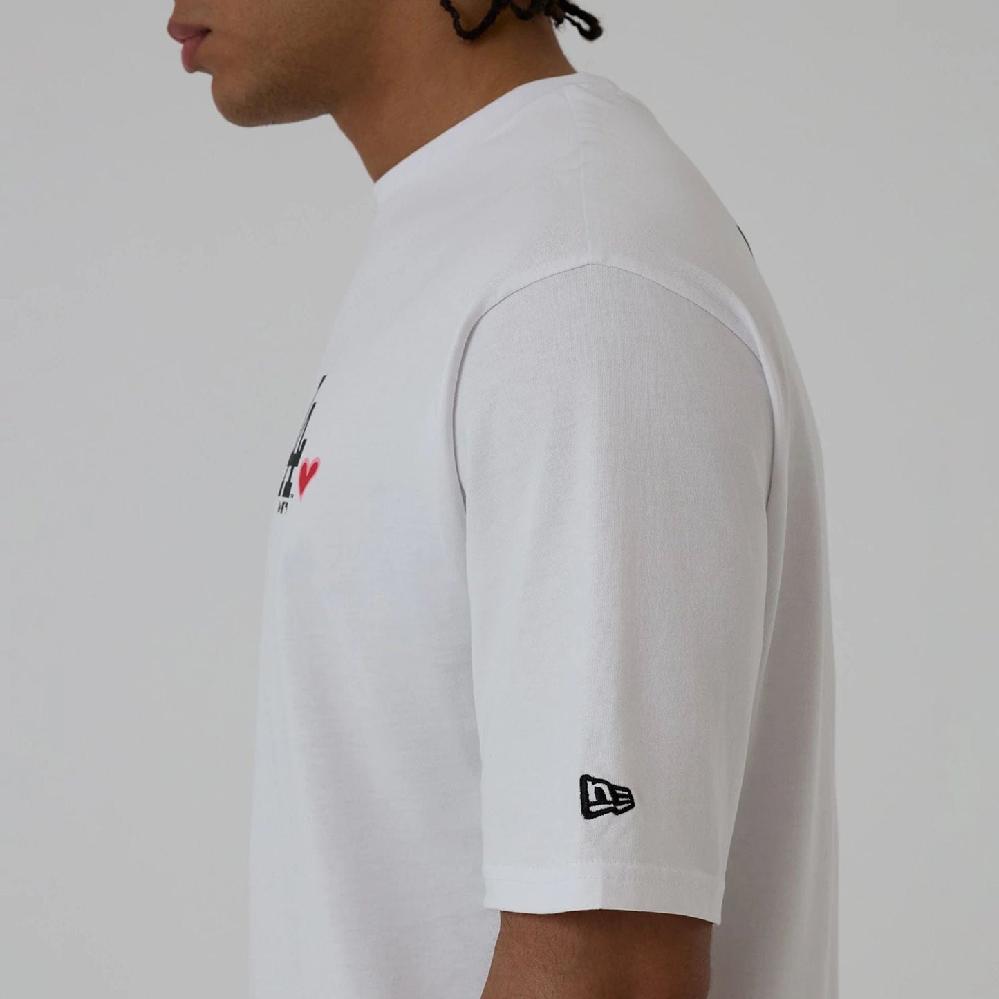 The model is wearing this MLB Heart Graphic LA Dodgers T-Shirt in white. 5
