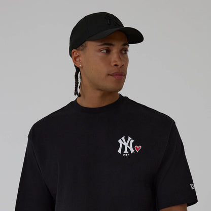 The model is wearing this MLB Heart Graphic New York Yankees T-Shirt in black. 3