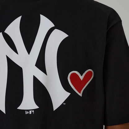 The model is wearing this MLB Heart Graphic New York Yankees T-Shirt in black. 5