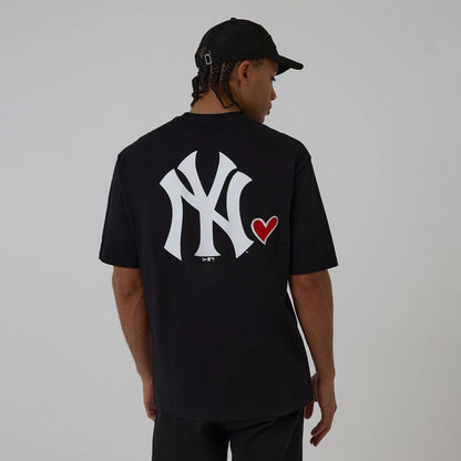 The model is wearing this MLB Heart Graphic New York Yankees T-Shirt in black. 2
