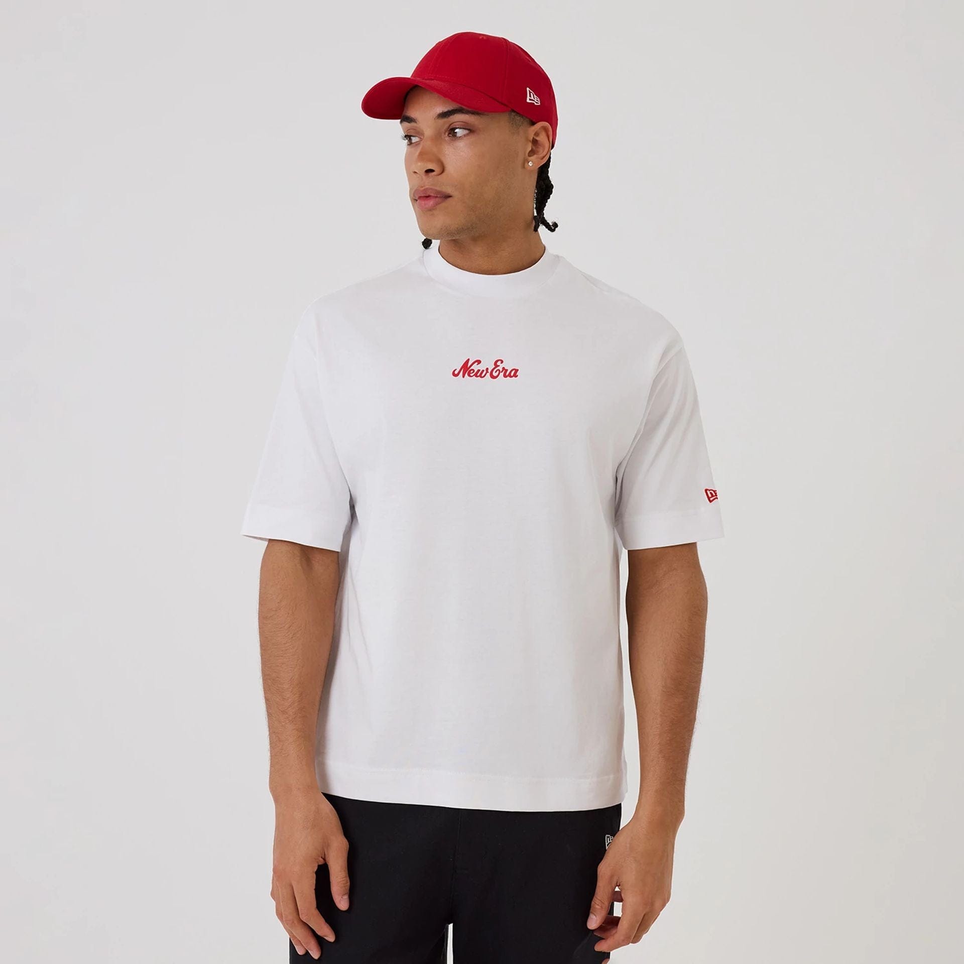 The model is wearing this New Era Love Graphic T-Shirt in white. 1