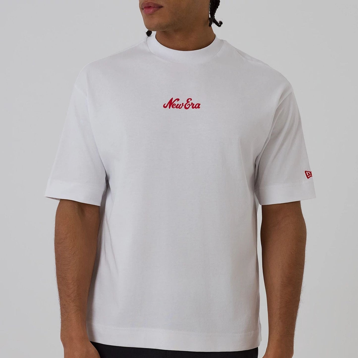 The model is wearing this New Era Love Graphic T-Shirt in white. 7