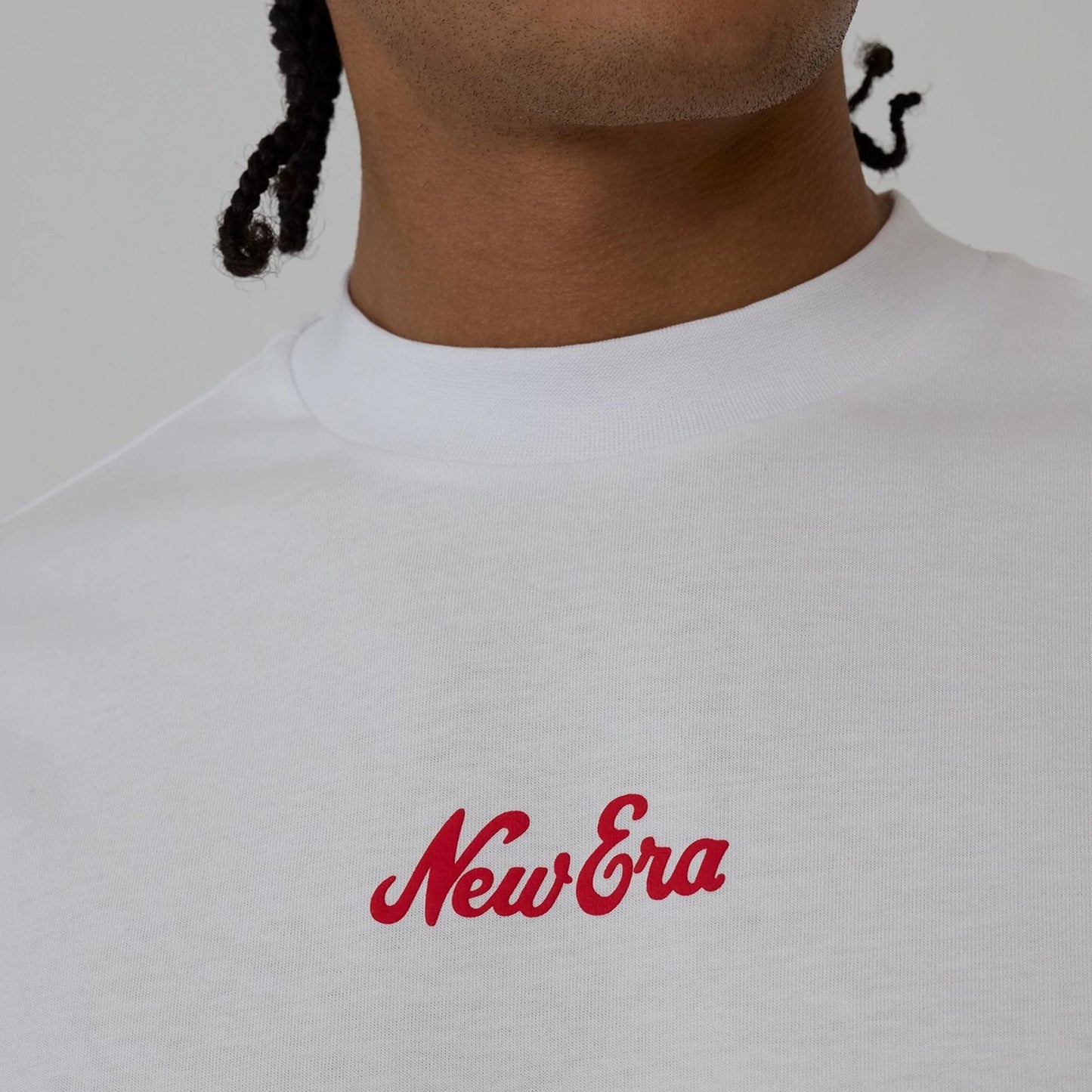 The model is wearing this New Era Love Graphic T-Shirt in white. 4