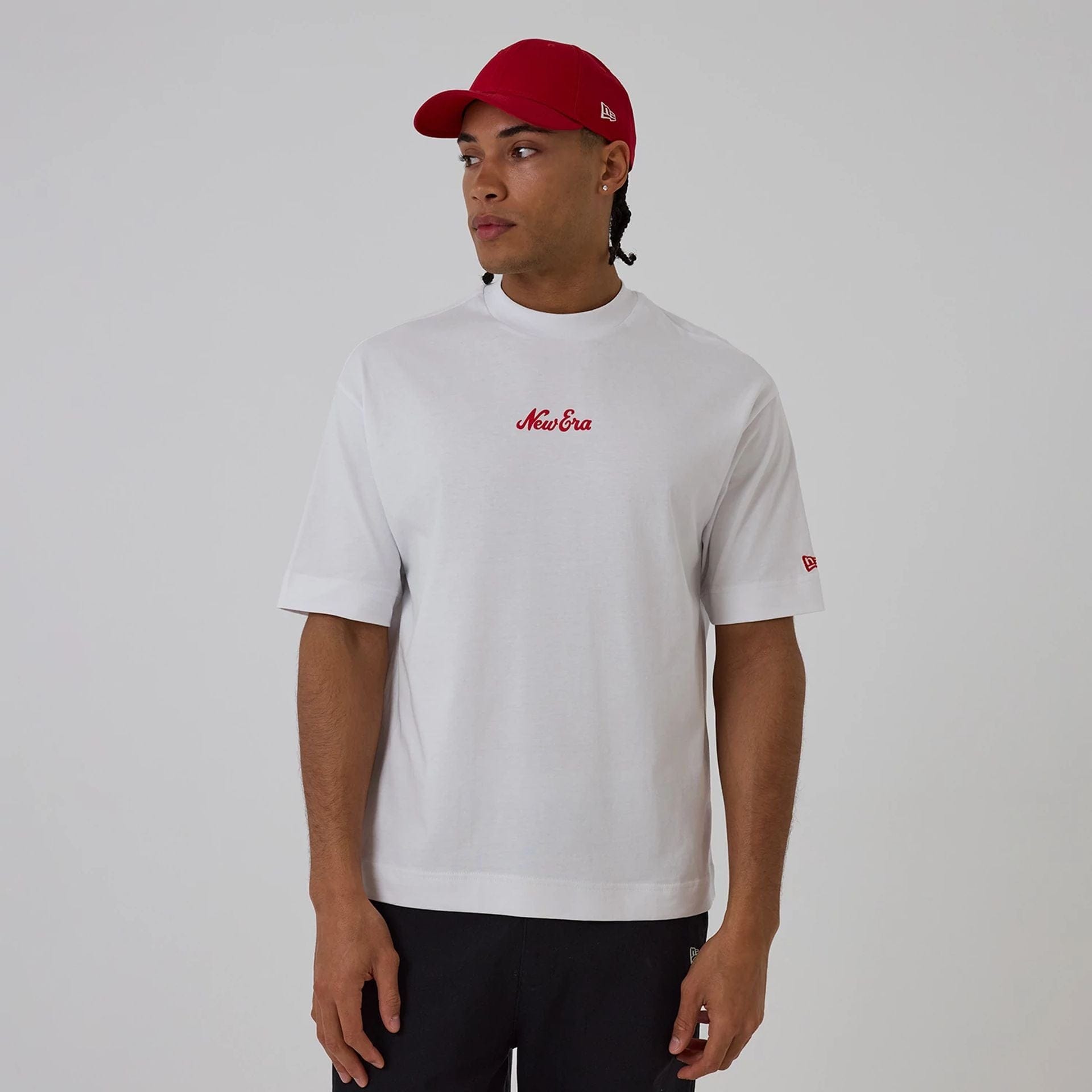 The model is wearing this New Era Love Graphic T-Shirt in white. 1