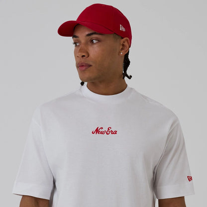 The model is wearing this New Era Love Graphic T-Shirt in white. 3