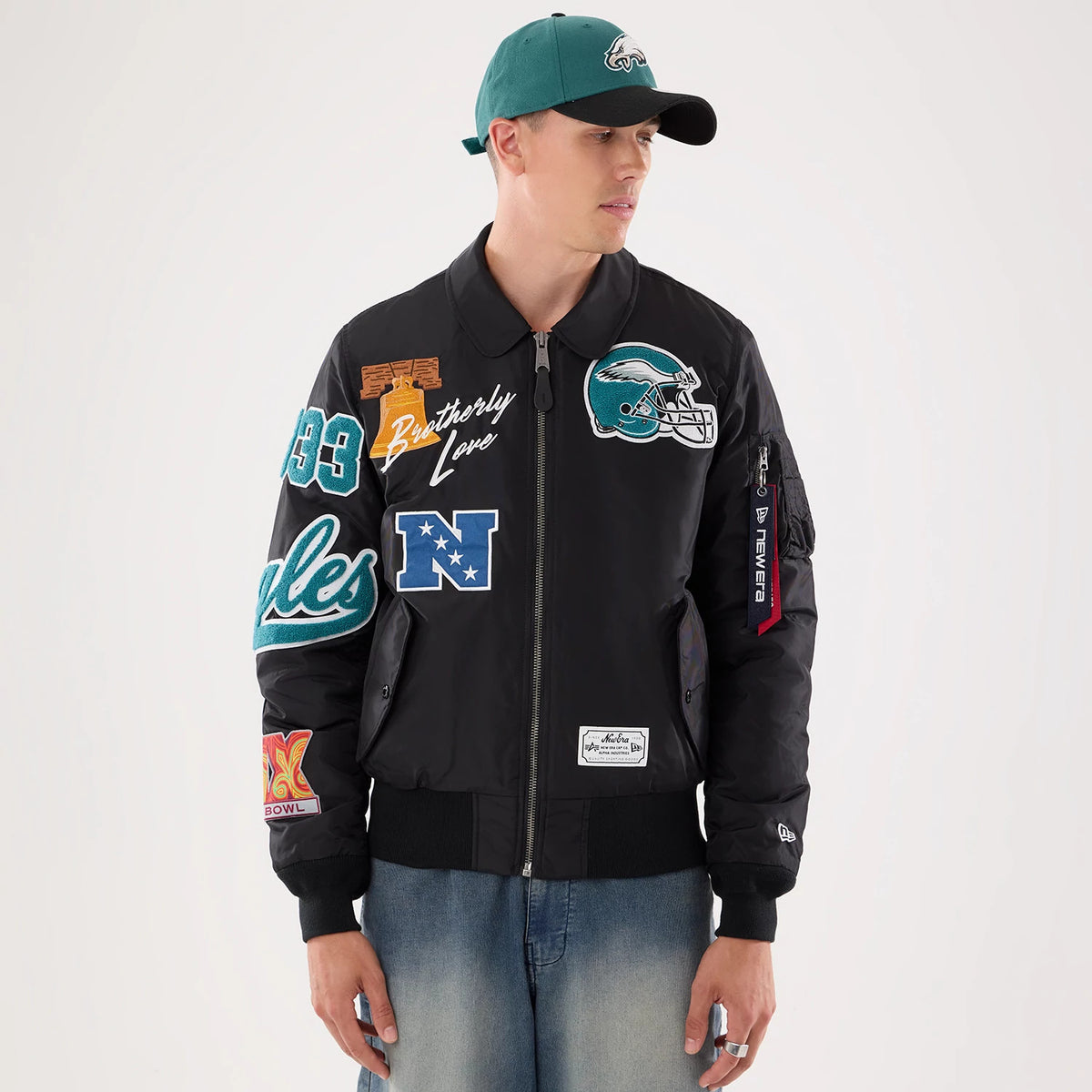 The model is wearing this NFL X Alpha Philadelphia Eagles Jacket in Black. 1