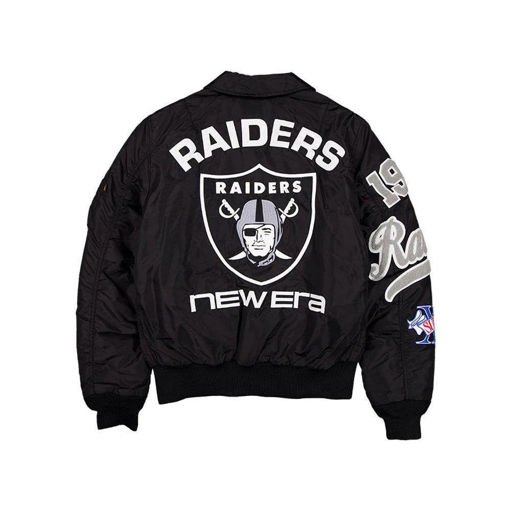 The model is wearing this NFL X Alpha Las Vegas Raiders Jacket in assorted print. 2