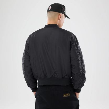 The model is wearing this NBA X Alpha Chicago Bulls Bomber Jacket & Tactical Vest in black. 2