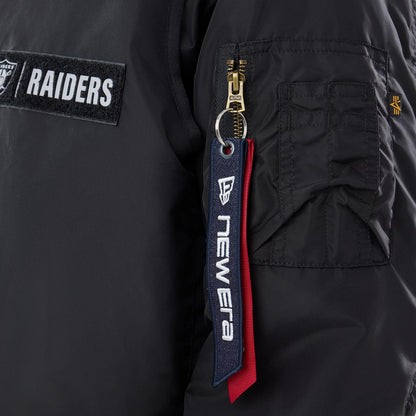 The model is wearing this NFL X Alpha Las Vegas Raiders Bomber Jacket & Tactical Vest in black. 4