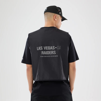 The model is wearing this NFL X Alpha Las Vegas Raiders Bomber Jacket & Tactical Vest in black. 2