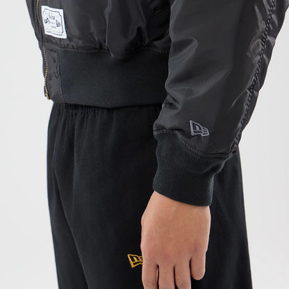 The model is wearing this MLB X Alpha New York Yankees Bomber Jacket & Tactical Vest in black. 6