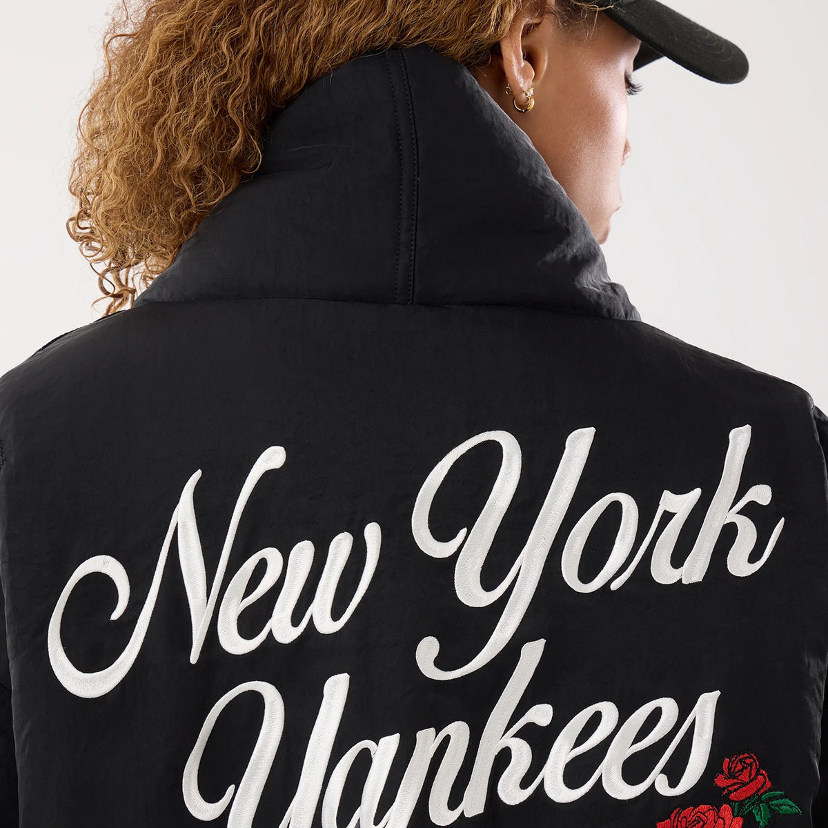 The model is wearing this MLB X Alpha New York Yankees Jacket in black. 5