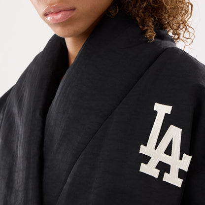 The model is wearing this MLB X Alpha LA Dodgers Jacket in black. 3