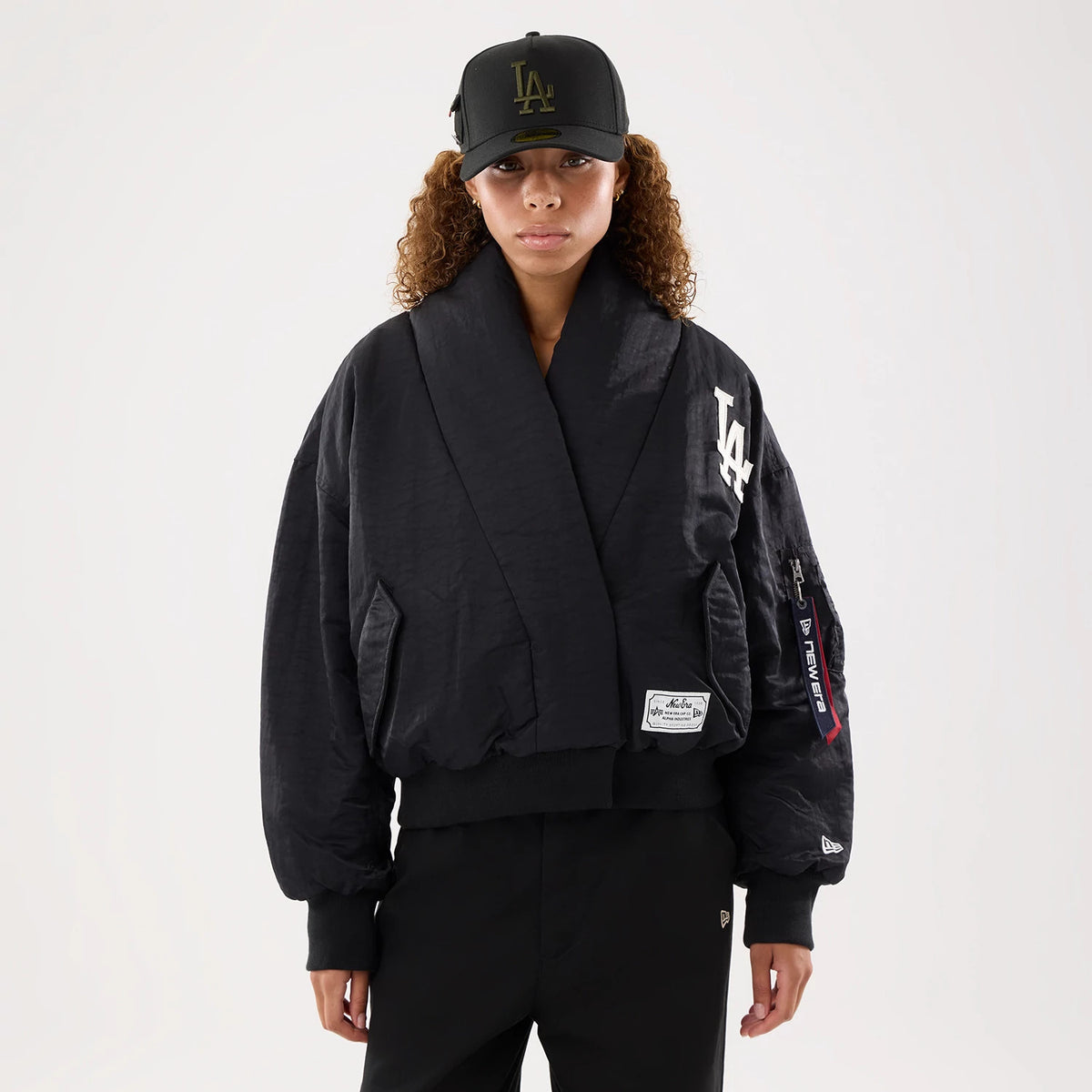 The model is wearing this MLB X Alpha LA Dodgers Jacket in black. 1