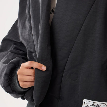 The model is wearing this MLB X Alpha LA Dodgers Jacket in black. 6