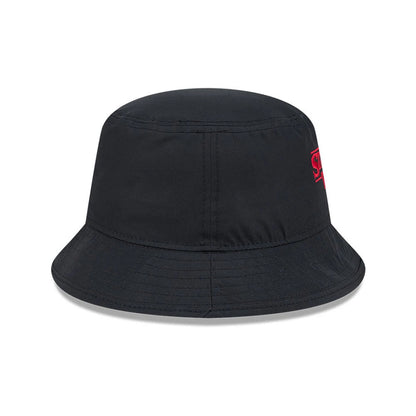 New Era Netflix Stranger Things Black Bucket Hat, side view showing the red embroidered Stranger Things logo on the left side, with a soft black crown and a downward sloping visor featuring stitching for added detail.