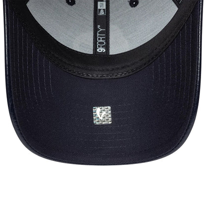 Vespa Crinkle PU Navy New Era 9FORTY Adjustable Cap, inside view showing grey sweatband with black taping featuring the 9FORTY logo, a silver holographic sticker on the navy undervisor, and black stitching lines along the visor curve.