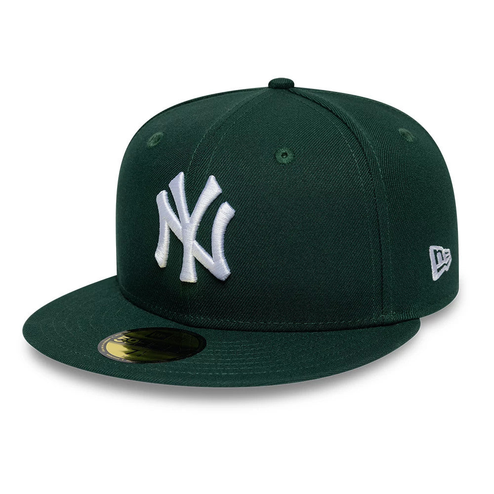 Pictured is this MLB League Essential New York Yankees 59FIFTY Fitted cap in dark green. 1