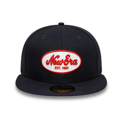 Pictured is this New Era Oval Patch 59FIFTY Fitted cap in navy. 2