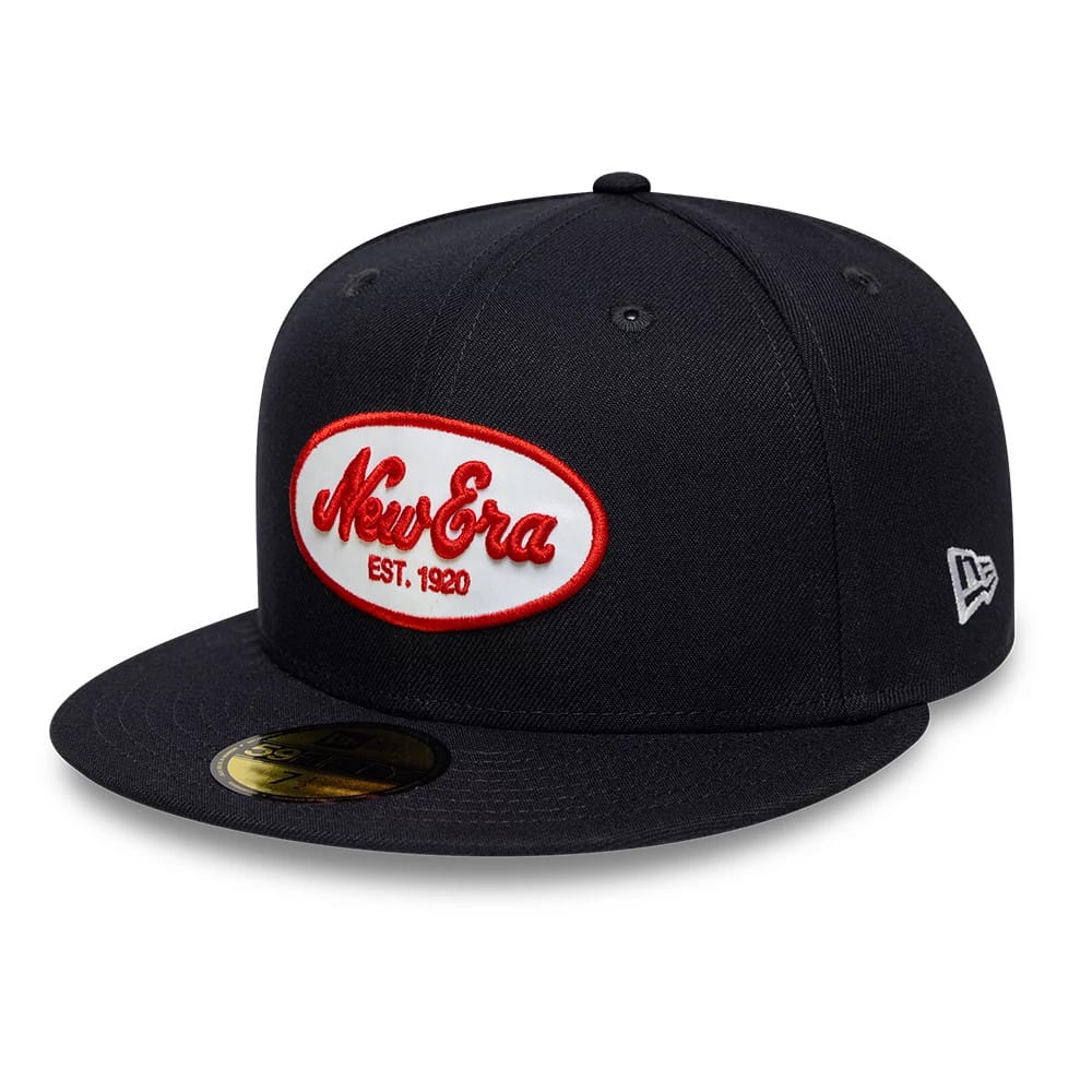 Pictured is this New Era Oval Patch 59FIFTY Fitted cap in navy. 1