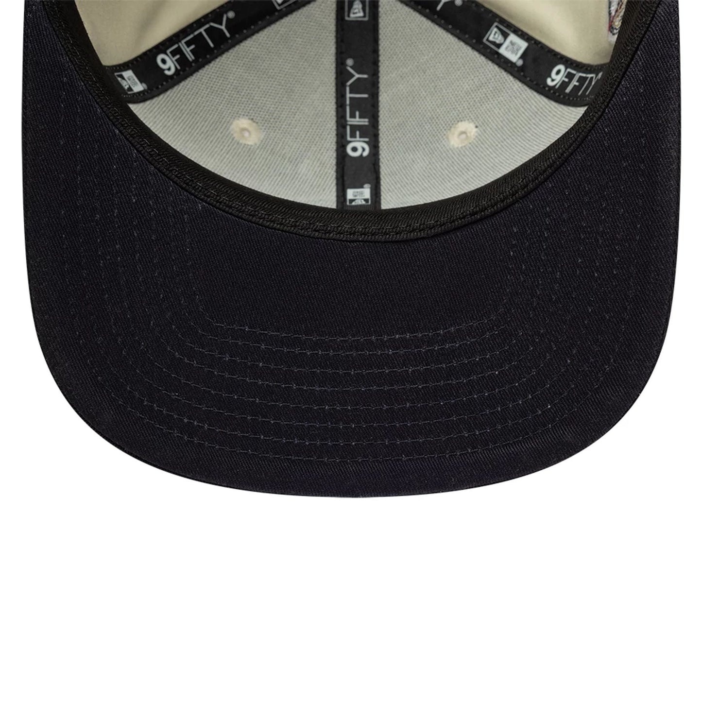 Pictured is this MLB World Series Patch New York Yankees 9FIFTY Snapback Adjustable cap in light beige. 5