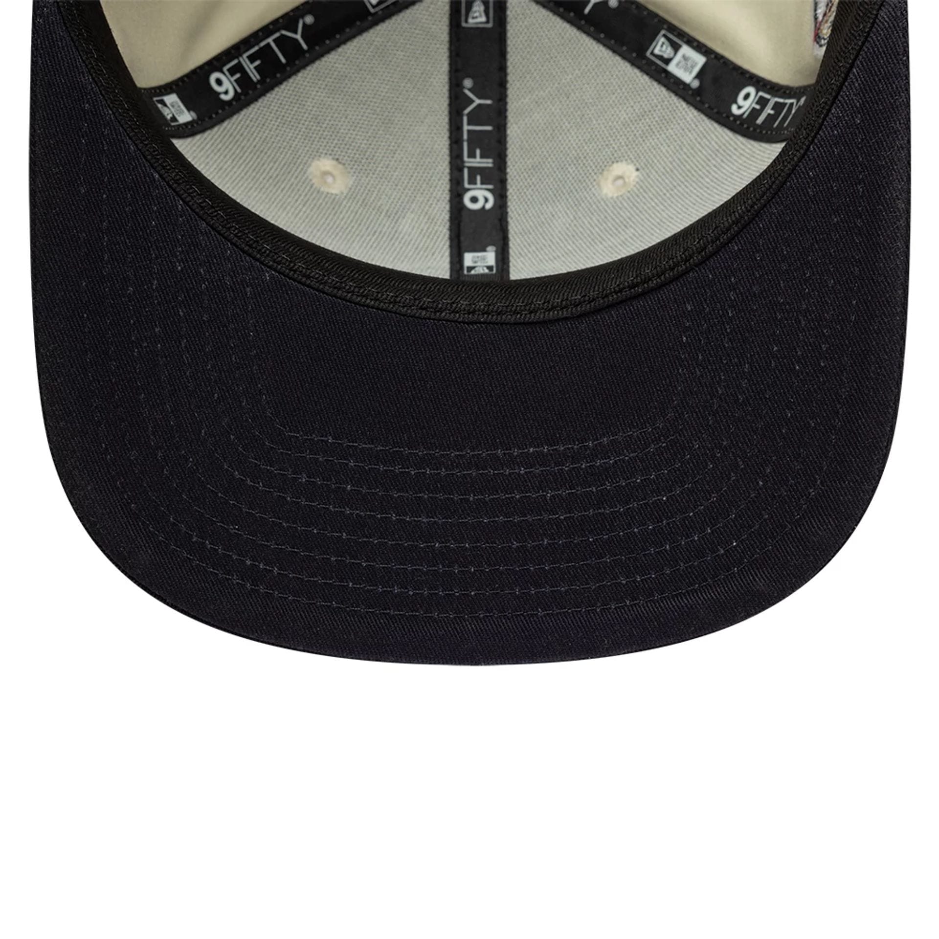 Pictured is this MLB World Series Patch New York Yankees 9FIFTY Snapback Adjustable cap in light beige. 5