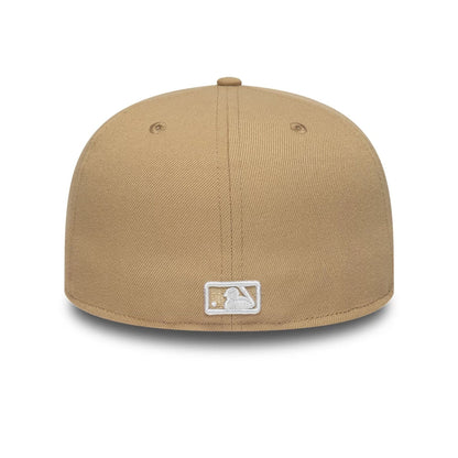 Pictured is this MLB League Essential New York Yankees 59FIFTY Fitted cap in light beige. 4