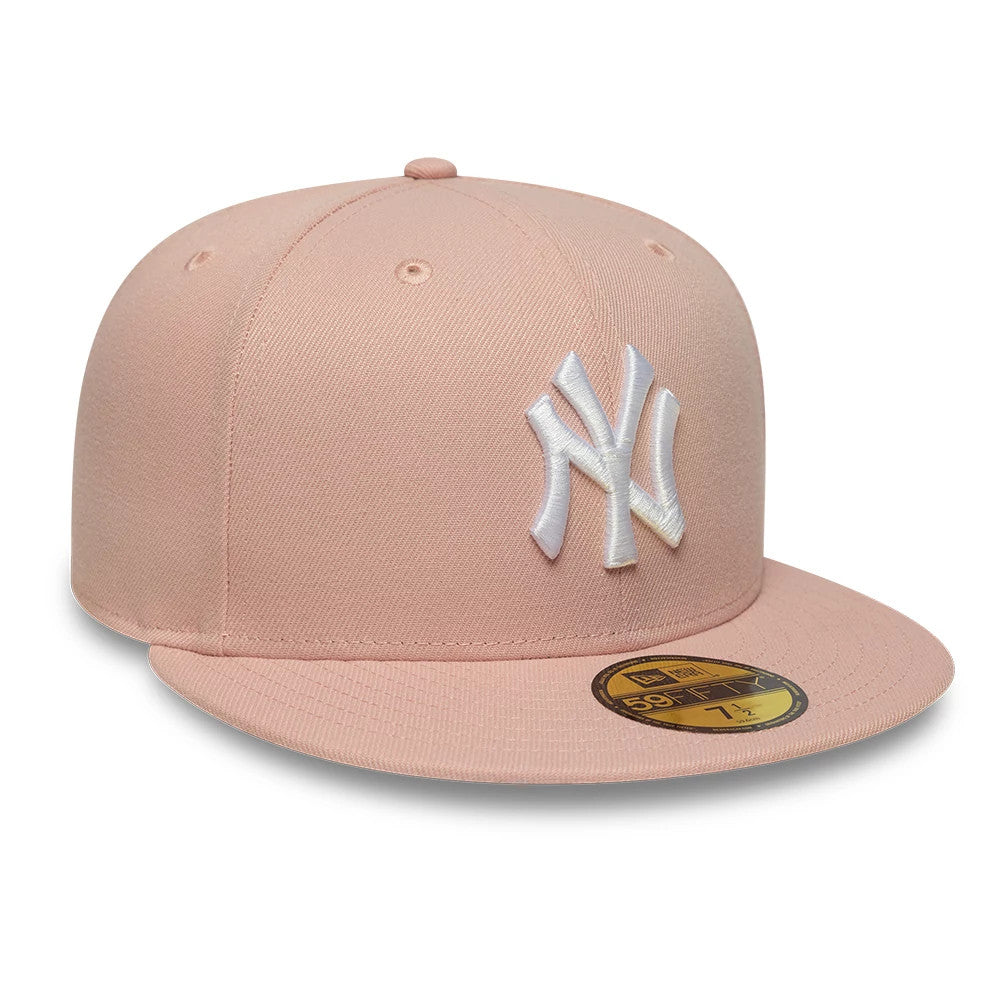 New York Yankees MLB League Essential Pastel Pink New Era 59FIFTY Fitted Cap, front view showing the white raised embroidered NY logo on the structured pastel pink crown, complemented by a matching pastel pink flat visor.