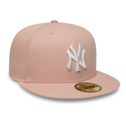 New York Yankees MLB League Essential Pastel Pink New Era 59FIFTY Fitted Cap, front view showing the white raised embroidered NY logo on the structured pastel pink crown, complemented by a matching pastel pink flat visor.