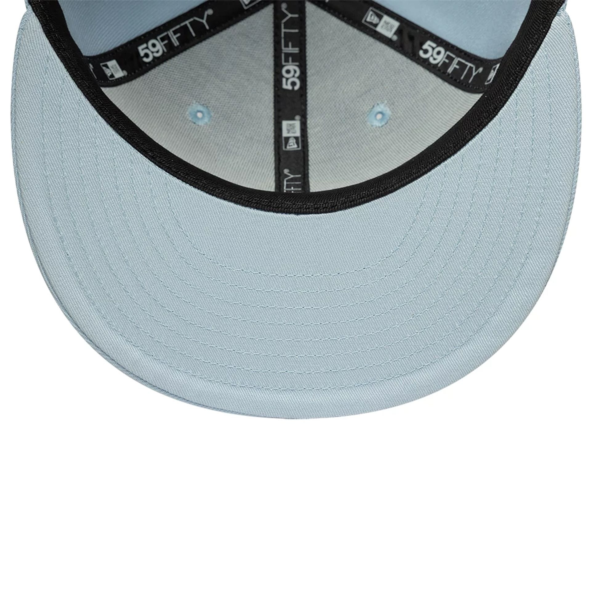 Pictured is this MLB League Essential New York Yankees 59FIFTY Fitted cap in pastel blue. 5
