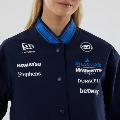 The model is wearing this Womens Atlassian Williams F1 Team Varsity Jacket in navy. 3