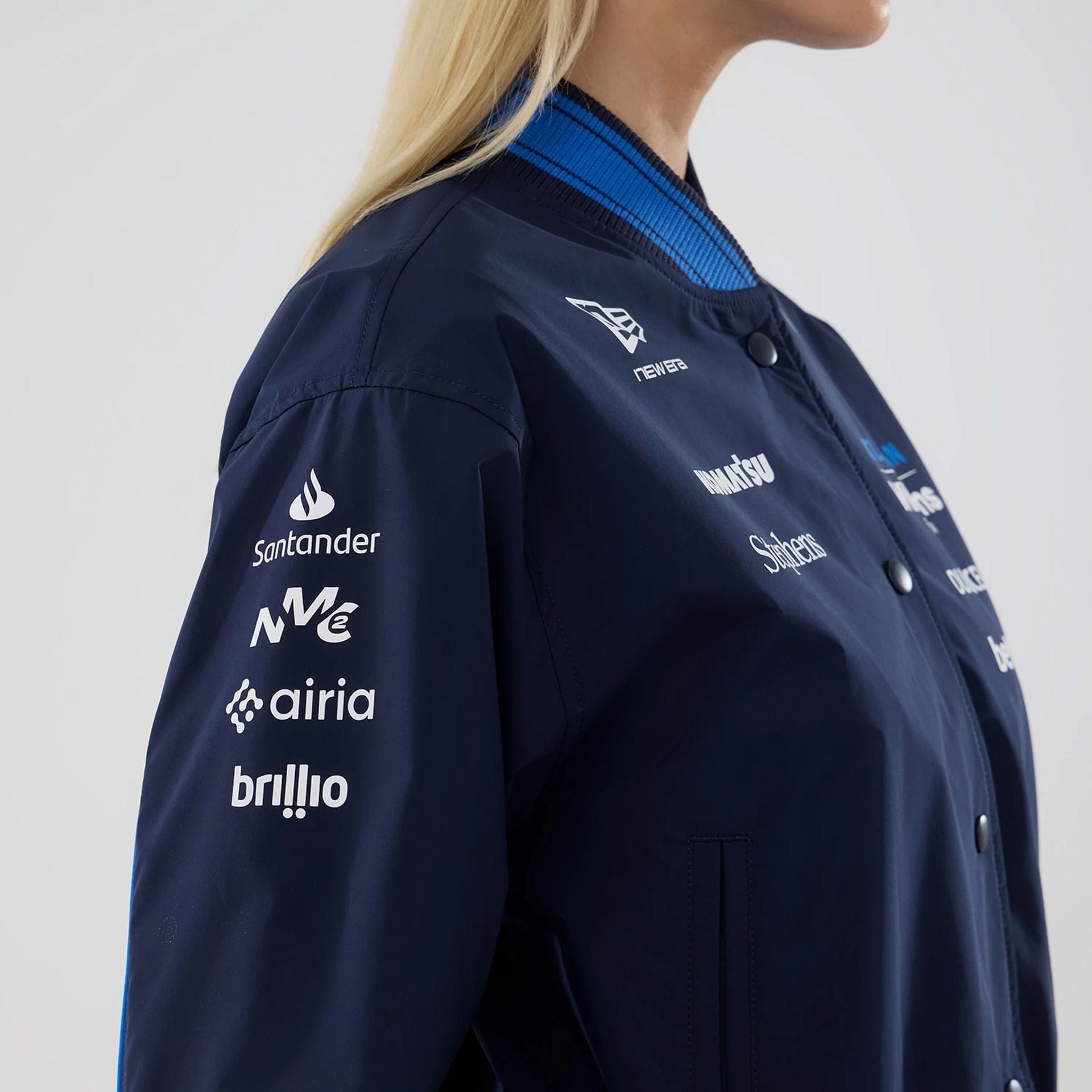 The model is wearing this Womens Atlassian Williams F1 Team Varsity Jacket in navy. 6